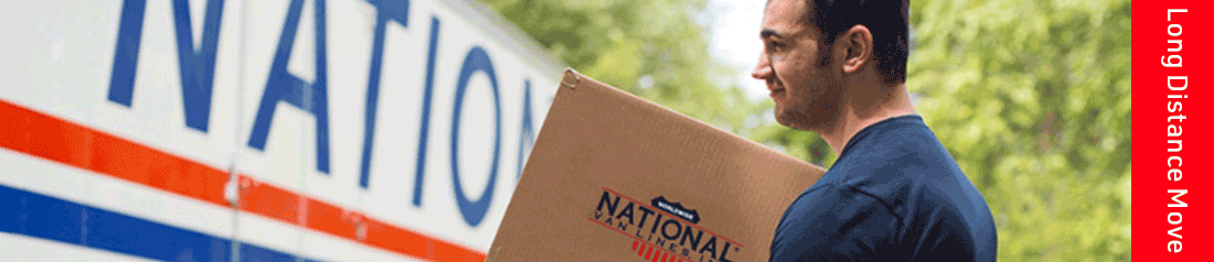 A man carrying a box to the National Van Lines truck for their long distance move