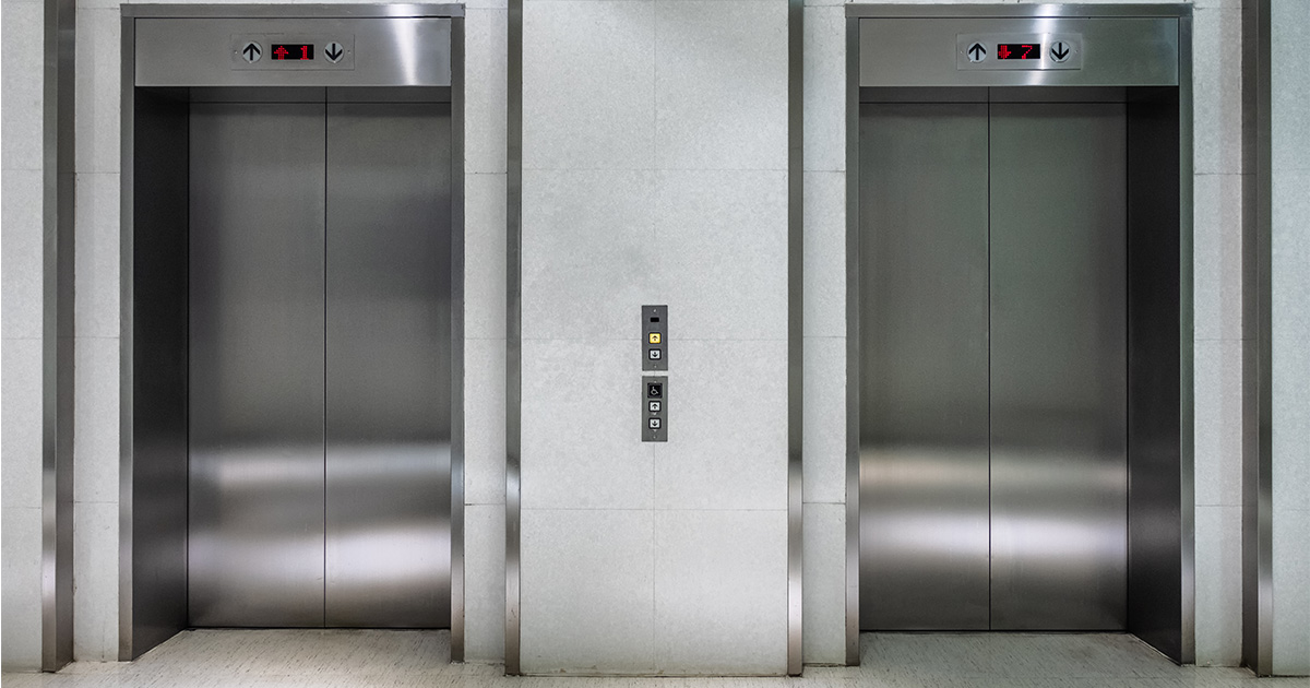 Two silver elevators. 