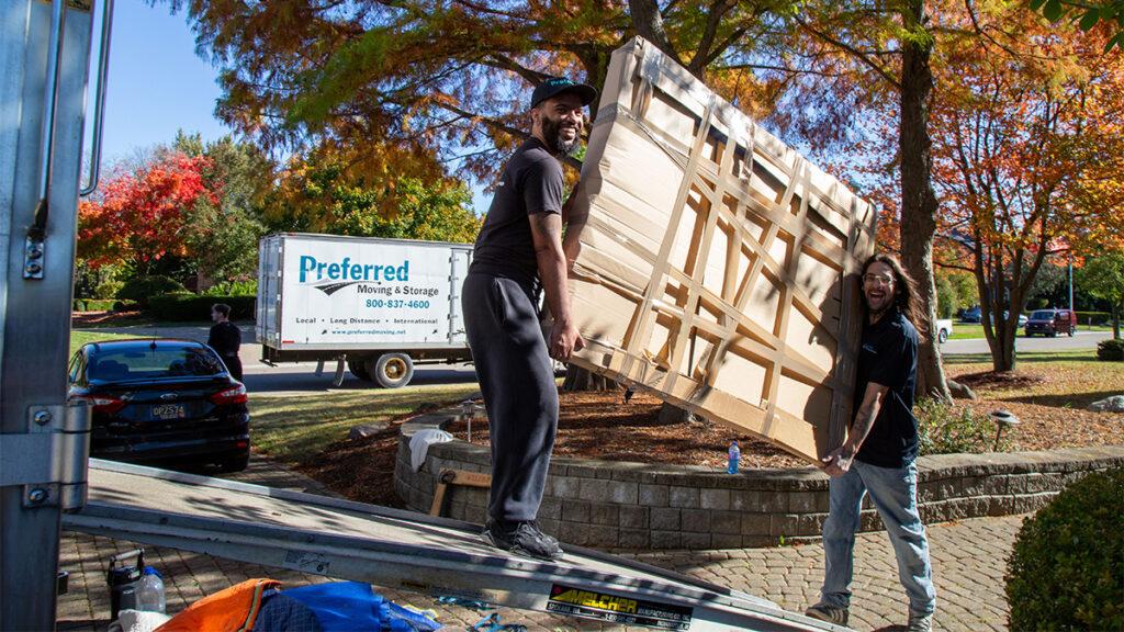Professional moving company loading household items in a residential neighborhood in Michigan