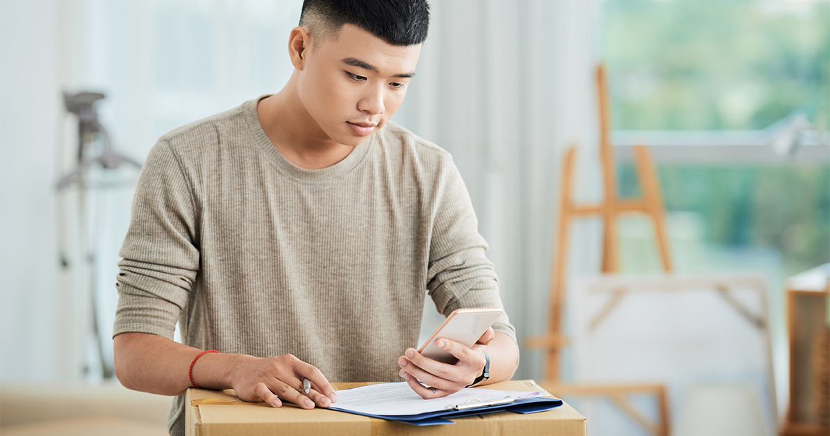 Asian man getting ready to move