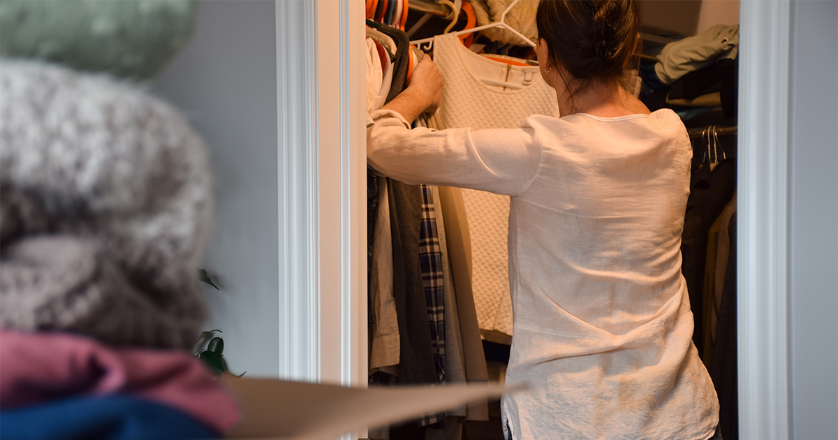 Lady getting ready to pack clothes